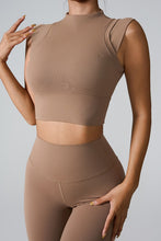 a model posing the front view of the Camel color Mock Neck Active Tank