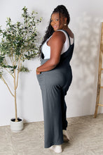 Back view of Cloudy Blue Cyrella Muse Overalls with adjustable wide straps visible.