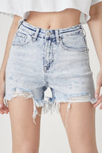 Model front view of RISEN Raw Hem High Rise Denim Shorts paired with a cropped white tank and sandals, perfect for summer brunch dates.