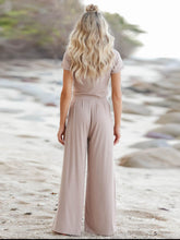Auralenne Coastal Lounge Set in tan back view on the beach
