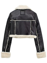 Back view of the soft black/white sherpa-trimmed cropped jacket, highlighting the mock shearling trim detail. 