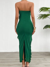 Back view of the Dark Green Seraflore™ Maxi Dress with a high slit and cascading ruffles.