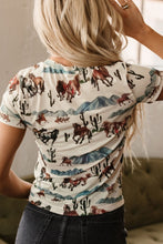 Back view of model in the mesh Mustang River t-shirt showing the breathable, semi-sheer fabric paired with high-rise jeans and loose waves.