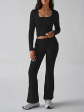 Close‑up detail of Black Liahnique fabric stretch and ruched bootcut hem