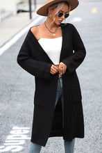 Woman in classic black Thalora Cascade Cardigan with open front layering.