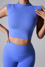 Front view of the Blue color Mock Neck Active Tank on woman.