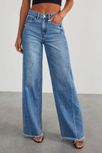 Front view of BluviaFold™ Wide Leg Raw Hem Jeans on model