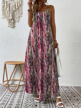 Model posing in the burgundy color Jewel of Northern Lights Maxi Cami Dress paired with jewelry, a white handbag with a wooden round strap, and white heels got classy look.