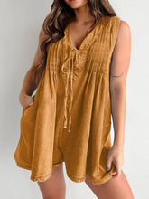 Model in caramel romper styled with wooden bangles and tan slides—warm tones perfect for golden hour looks.
