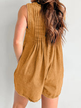 Pleated back in rich caramel denim highlighted in natural light, styled with hair in a braided crown.