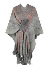 Front view of charcoal Heathered Fringe Hem Poncho against a neutral backdrop, showing textured knit, subtle multicolor threads, and pom pom fringe trim.