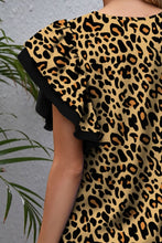 Close-up of the olive leopard print fabric, showing the soft texture and bold, contrasting animal pattern with subtle sheen.