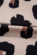 Close-up of soft Mocha leopard print fabric texture and round showcasing material quality.