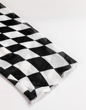 Flat lay of ChicGrid checkered blouse in black, displaying premium long sleeve stitching, and quality polyester elastane blended fabirc check pattern.