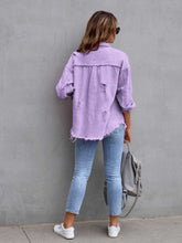 Back view of model in a lavender CloudKitten Distressed Drop Shoulder Denim Jacket, showing light distressing and easy, drop shoulder construction.