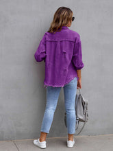 Back view of model wearing a violet CloudKitten Distressed Drop Shoulder Denim Jacket, featuring clean back seaming and a loose, modern silhouette.