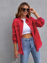 Model wearing the deep red color CloudKitten Distressed Drop Shoulder Denim Jacket paired with a white crop top, blue jeans, Jewelry, and handbag.