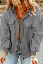 Side view of cloudy blue Nivora™ DriftZip Hoodie on model, highlighting the clean side seam, pockets, and adjustable hood.