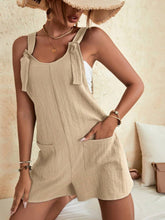 Cream romper styled with gold jewelry and nude heels for a brunch-ready outfit.