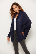 Woman modeling Dark Navy SeraphinaWing Open Front Cardigan, front view with soft sleeve drape.