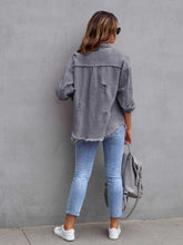 Back view of model in a charcoal CloudKitten Distressed Drop Shoulder Denim Jacket, with light distressing and a comfortably relaxed cut.