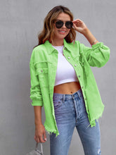 A model wearing the lime color CloudKitten Distressed Drop Shoulder Denim Jacket paired with a white crop top, blue jeans, Jewelry, and handbag.