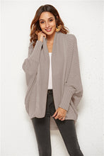 Woman wearing SeraphinaWing Open Front Cardigan in Dust Storm, front view with batwing sleeves and open front.