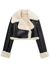 Front zoomed-in detail of faux leather texture and sherpa trim on the black/white Nuvira Frostloom jacket.