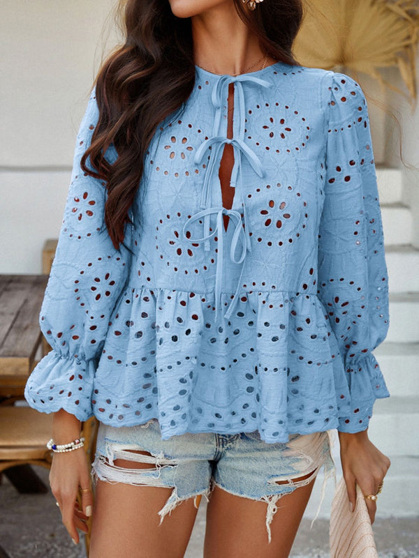 Model on a park stroll wearing PeplumMuse™ Blouse in Light Blue, styled with light wash denim shorts, tan ruffled handbag, delicate bracelets, and comfy flat sandals.