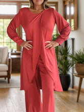 Close up full body pose of Kurevelle Slit Round Neck Top and Pants Twosome in orange-red