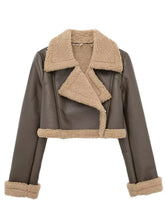 Front zoomed-in detail of faux leather texture and sherpa trim on the coffee brown Nuvira Frostloom jacket.