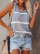 Woman wearing gray Tie-Dye Round Neck Tank styled with light blue distressed shorts, a crossbody bag, and sandles for a vacation getaway.
