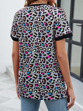 Rear shot of gray dawn leopard print short sleeve tee highlighting soft fabric drape and classic tee silhouette.