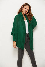 Woman wearing Green SeraphinaWing Open Front Cardigan, front view with arms relaxed at sides.