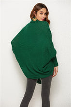 Back view of woman in Green SeraphinaWing Cardigan, highlighting the flow of batwing sleeves and relaxed fit.