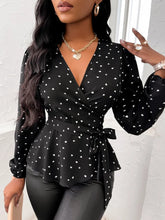 Model styled in black AmoréDot™ Top with leather pants, heels, and accessories for a complete look.