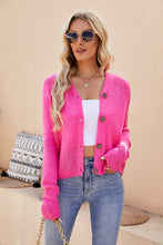Close-up of the Solavelle™ V-Neck Cardigan in hot pink, highlighting the soft knit texture, V-neckline stitching, and button detail.