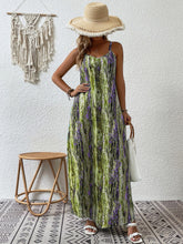 Model posing in the Lime color Jewel of Northern Lights Scoop Neck Maxi Cami Dress styled with a woven straw hat with white raw trim, jewelry, a white handbag with wooden round strap, and white heels at Restaurante Rosetta in Mexico City.