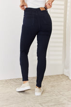a woman modeling a back view of navy Judy Blue Tummy Control Skinny Jeans