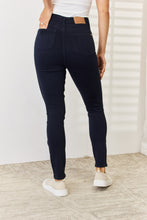 a woman modeling a back view of navy Judy Blue Full Size Garment Dyed Tummy Control Skinny Jeans