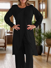 Close up full body pose of Kurevelle Slit Round Neck Top and Pants Twosome in black
