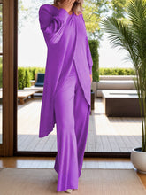 Full body pose wearing Kurevelle Slit Round Neck Top and Pants Twosome in purple