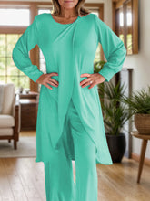 Close up full body pose of Kurevelle Slit Round Neck Top and Pants Twosome in turquiose