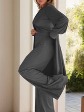 Side view of Kurevelle Slit Round Neck Top and Pants Twosome in dark gray showing wide leg and slit top