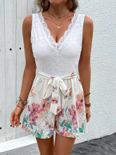 Romper styled with gold jewelry, strappy heels, and a clutch—perfect for brunch, vacation, or summer parties, blending elevated lace with playful floral charm.