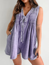 Model in lavender romper, tie string styled in a bow, paired with white sandals and a floral headband—soft and romantic vibe.