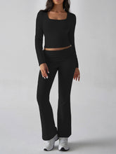 Model walking forward in Black Liahnique set showing movement and fit