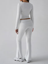 Back view of model wearing Light Gray Liahnique square neck top and ruched waist bootcut pants