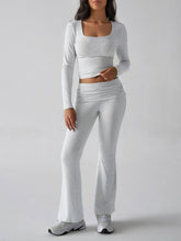 Close‑up detail of Light Gray Liahnique fabric stretch and ruched bootcut hem