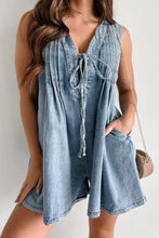 Model in light blue romper, tie string loosely fastened, styled with white sneakers and gold hoops—perfect for casual daytime looks.